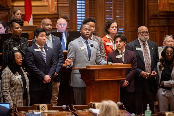 State Rep. Bryce Berry, D-Atlanta, surrounded by other Democratic lawmakers and supporters, recently spoke out about U.S. Immigration and Customs Enforcement at the Capitol in Atlanta. (Arvin Temkar/AJC)