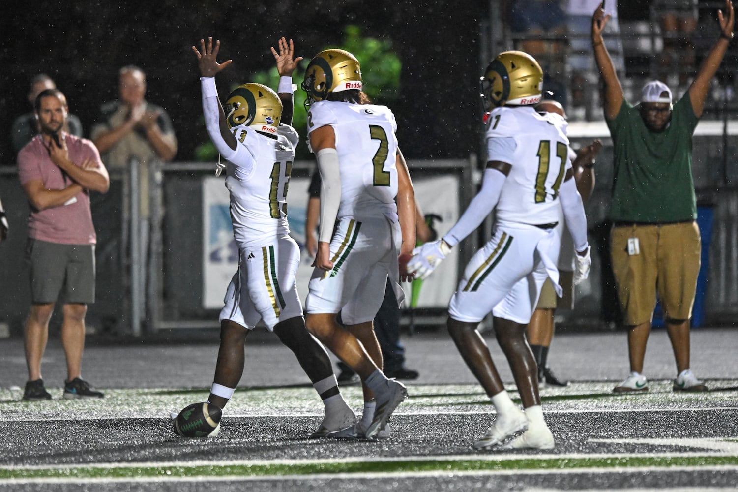 Grayson running back Ashton Turner (left) celebrates his touchdown against Collins Hill during the first half of play Friday, August 15, 2025. (Daniel Varnado for the AJC)