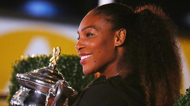 Tennis champ Serena Williams poses with the Daphne Akhurst Memorial Cup after winning the 2017 Women's Singles Australian Open Championship at Melbourne Park on January 28, 2017 in Melbourne, Australia.