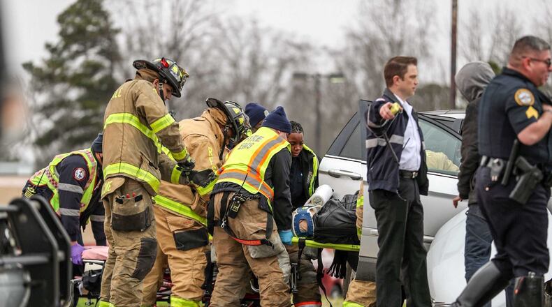 Clayton County fire and EMS crews worked to free a man who became trapped inside a minivan after colliding with a MARTA Mobility bus Tuesday morning.