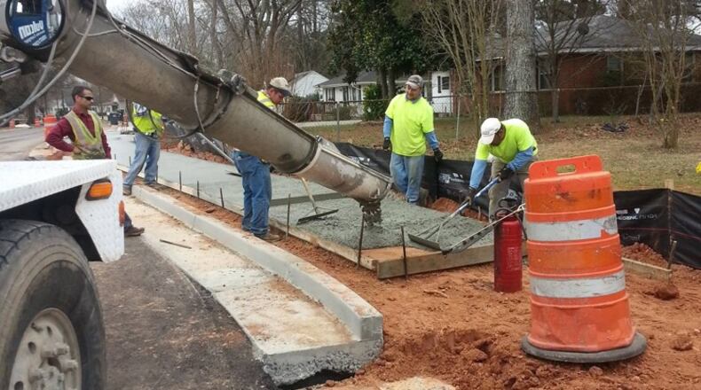 New sidewalks in Austell will make it easier for children to reach their school bus stop. AJC file photo