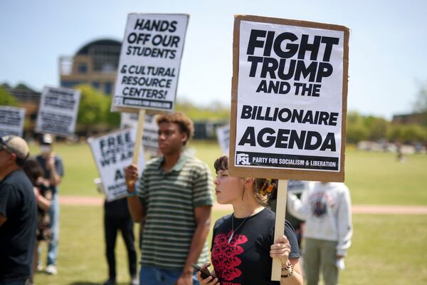 Around 20 protesters rallied against the Trump administration terminating the visa of a Kennesaw State student April 17, 2025. (Jason Getz/AJC)
