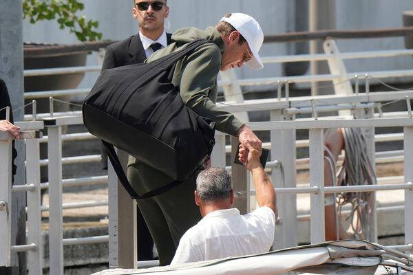 Former NFL quarterback Tom Brady, center, arrives for the weekend wedding of Amazon founder Jeff Bezos and Lauren Sanchez, in Venice, Italy, Thursday, June 26, 2025. (AP Photo/Luca Bruno)