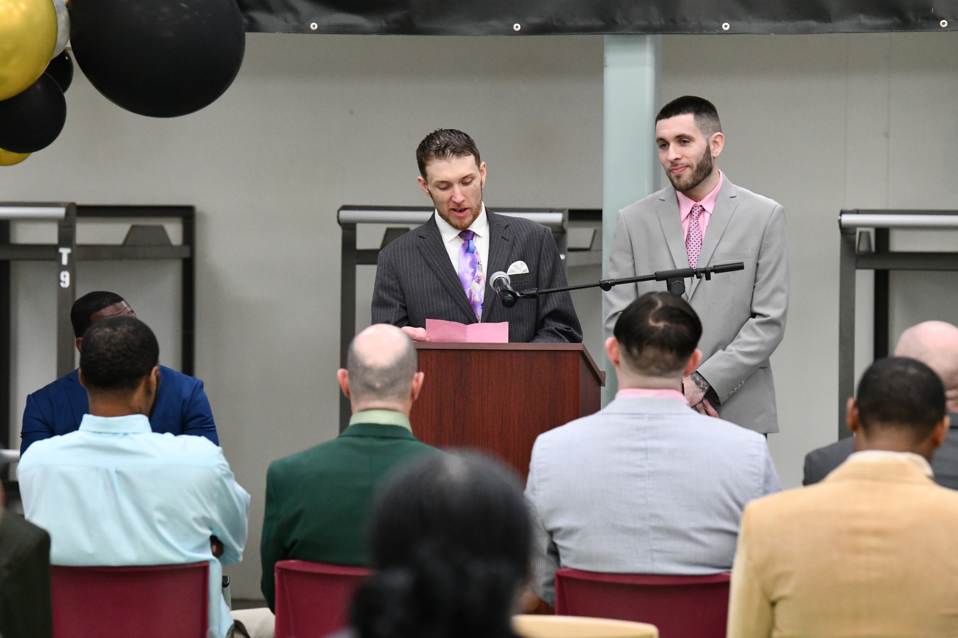 Program graduates Cameron Stockton speaks as Greg Mouzayck stands next him during their graduation ceremony for the Re-Entry Success Program at the Athens-Clarke County Jail on Wednesday, June 18, 2025, in Athens. (Hyosub Shin/AJC)