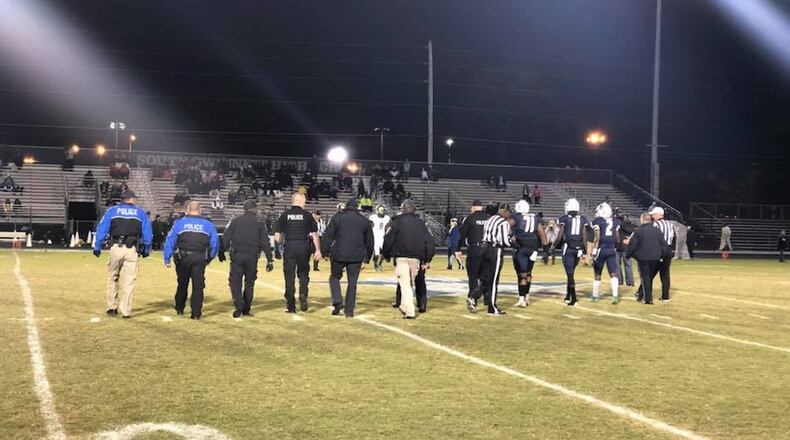 Officer Antwan Toney, a Gwinnett County police officer killed in the line of duty, was honored before South Gwinnett High School’s football game on Nov. 3. Student athletes linked arms with law enforcement officers, and a student read a poem written by South Gwinnett High English Teacher John Leece. CONTRIBUTED