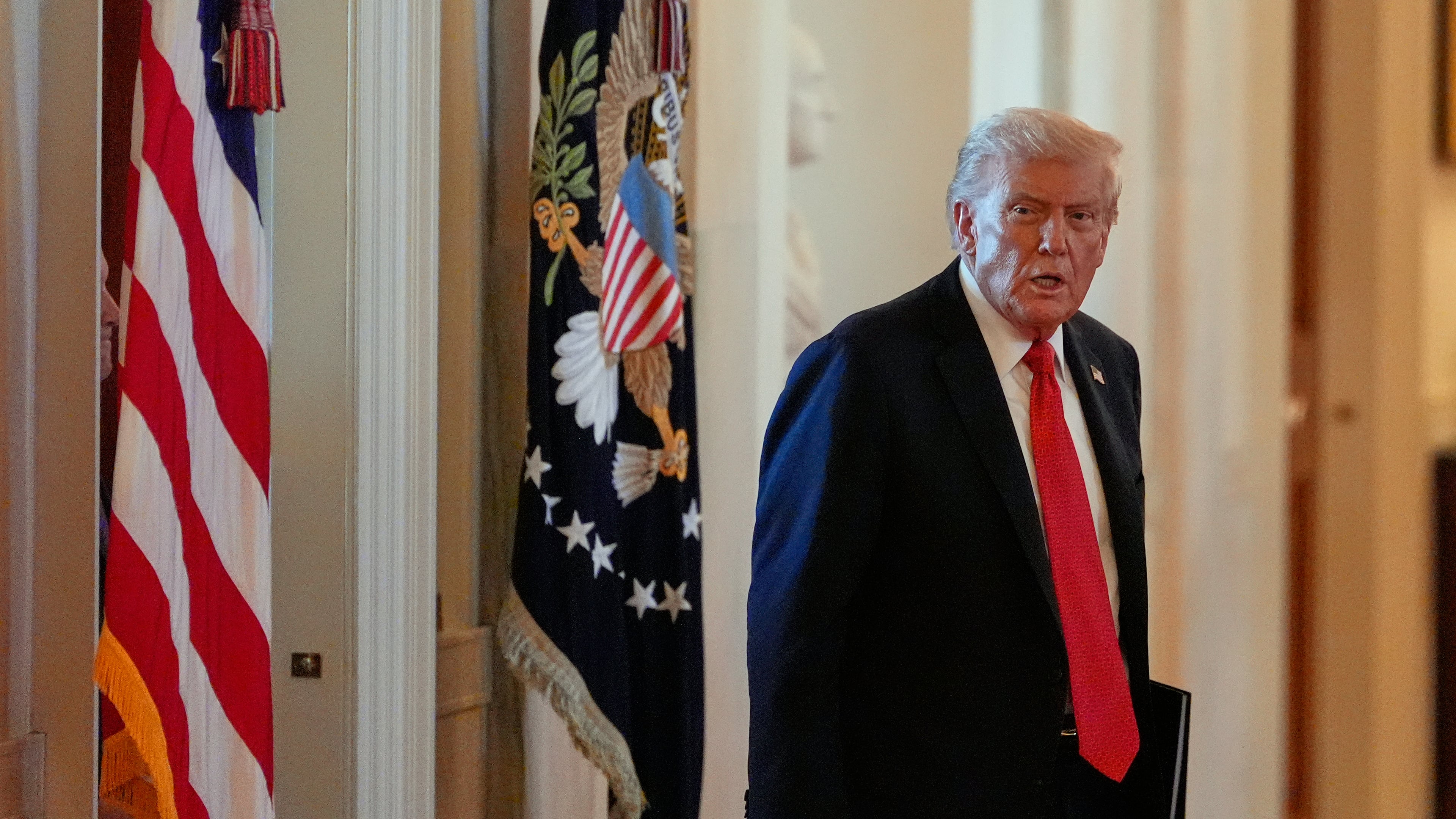 President Donald Trump arrives to speak during an event to welcome the 2025 LSU and LSU-Shreveport national champion baseball teams in the East Room of the White House, Monday, Oct. 20, 2025, in Washington. (AP Photo/Alex Brandon)