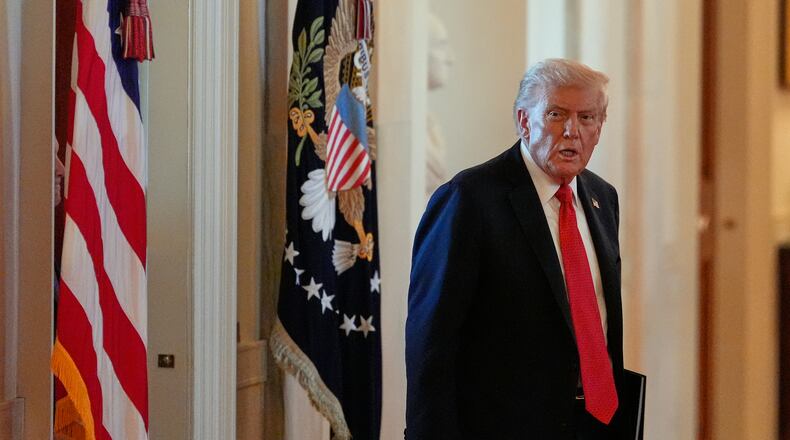 President Donald Trump arrives to speak during an event to welcome the 2025 LSU and LSU-Shreveport national champion baseball teams in the East Room of the White House, Monday, Oct. 20, 2025, in Washington. (AP Photo/Alex Brandon)