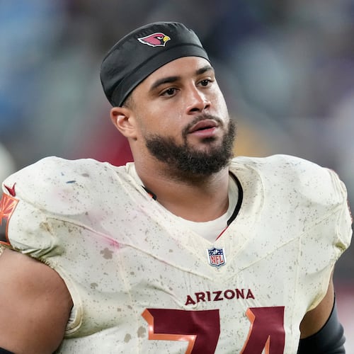 FILE - Arizona Cardinals guard Isaiah Adams walks off the field after an NFL football game against the Seattle Seahawks, Sept. 25, 2025, in Glendale, Ariz. (AP Photo/Ross D. Franklin, File)
