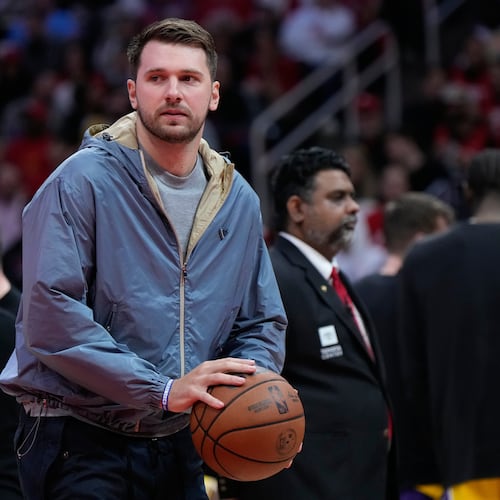 Los Angeles Lakers guard Luka Doncic holds a ball during a timeout in the first half of Game 6 of a first-round NBA playoffs basketball series against the Houston Rockets in Houston, Friday, May 1, 2026. (AP Photo/Ashley Landis)