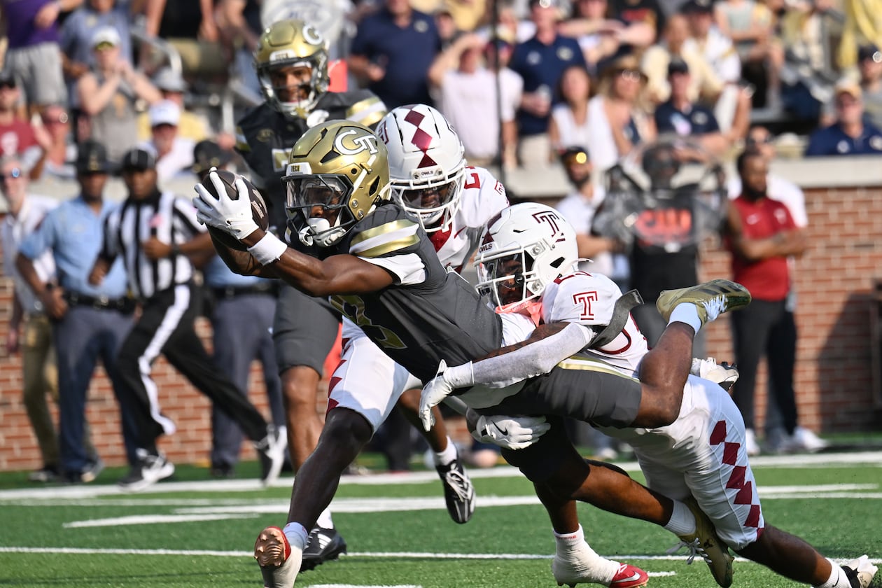 Georgia Tech wide receiver Malik Rutherford dives into the end zone past Temple safety Avery Powell for a touchdown at Bobby Dodd Stadium on Saturday, Sept. 20, 2025, in Atlanta. Rutherford is tied for the team lead in receptions with 23. (Hyosub Shin/AJC)