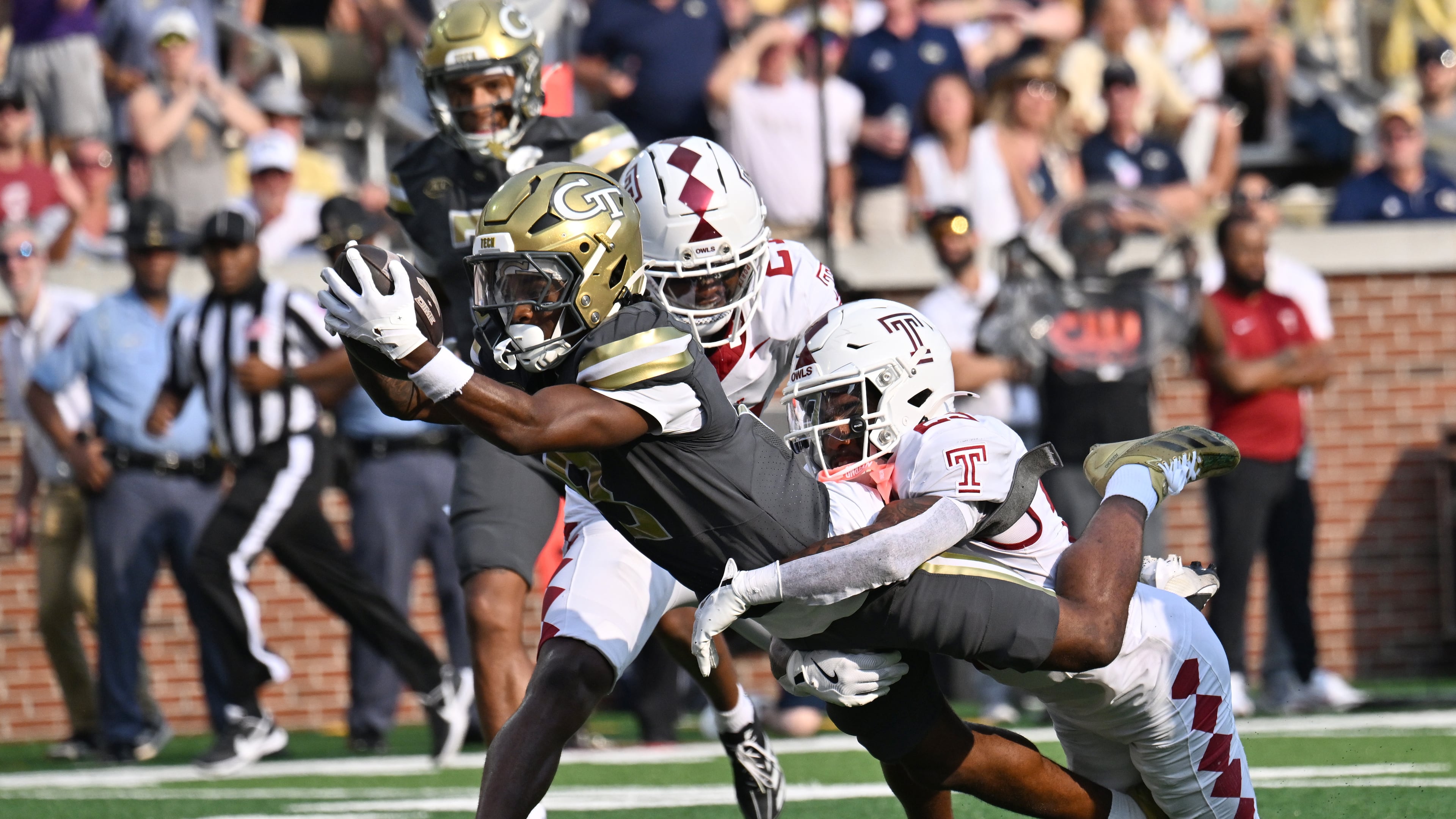 No. 18 Georgia Tech's 21-point first quarter was enough to overcome a sluggish second-quarter effort as the Jackets pulled away for a 45-24 win over Temple. (Hyosub Shin/AJC)