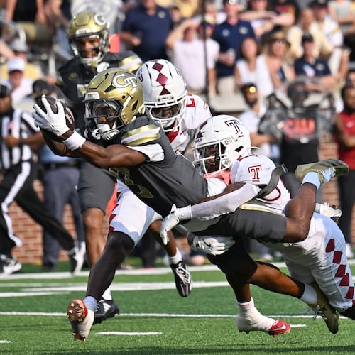 Georgia Tech wide receiver Malik Rutherford dives into the end zone past Temple safety Avery Powell for a touchdown at Bobby Dodd Stadium on Saturday, Sept. 20, 2025, in Atlanta. Rutherford is tied for the team lead in receptions with 23. (Hyosub Shin/AJC)