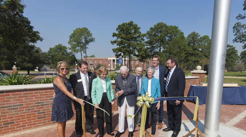 At Friday’s ribbon-cutting for Georgia Southwestern State University’s “Presidential Plaza” Friday are, from left: Kristi Weaver, Georgia Southwestern State University President Neal Weaver, Rosalynn Carter, Jimmy Carter, David Fite, Margaret Fite (granddaughter of former GSW President Peyton Jacob, 1934-1948), Peyton James Fite (great-great-grandson of Peyton Jacob) and Mark Fite (great-grandson of Peyton Jacob). Chris Fenn/Georgia Southwestern State University