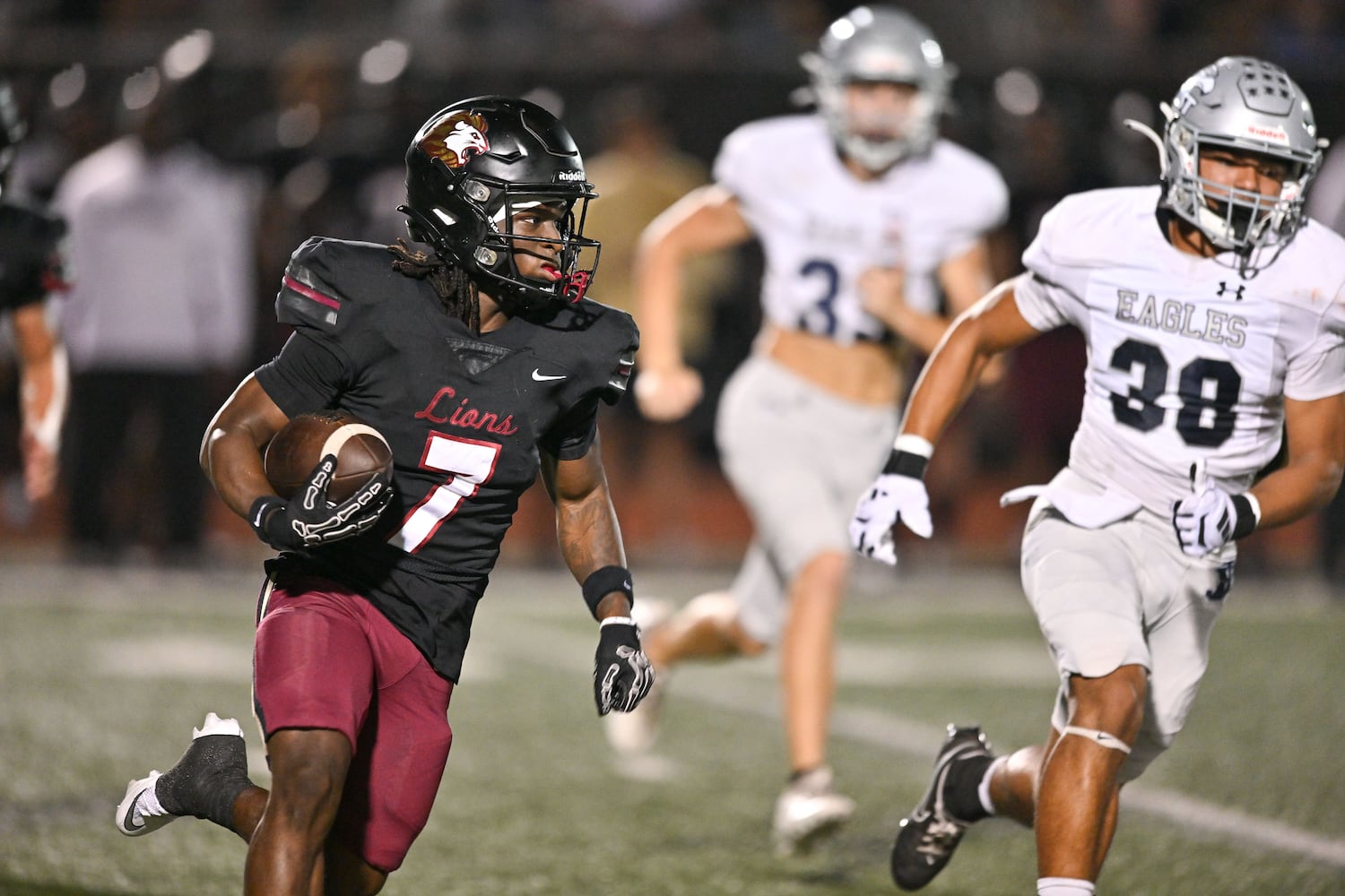 Hebron’s Jarvis Mathurin receives a kick off and returns the ball for a touchdown during the first half of play Friday, Sept. 26, 2025, at Hebron Christian Academy. (Daniel Varnado for the AJC)