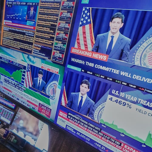 Federal Reserve Chair Kevin Warsh's press conference appears on screens on the floor of the New York Stock Exchange, Wednesday, June 17, 2026. (AP Photo/Richard Drew)