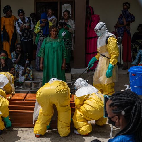 Family members of an Ebola victim mourn as the coffin is taken away for burial, at Sofepadi Hospital in Bunia, Congo, Saturday, May 23, 2026. (AP Photo/Moses Sawasawa)