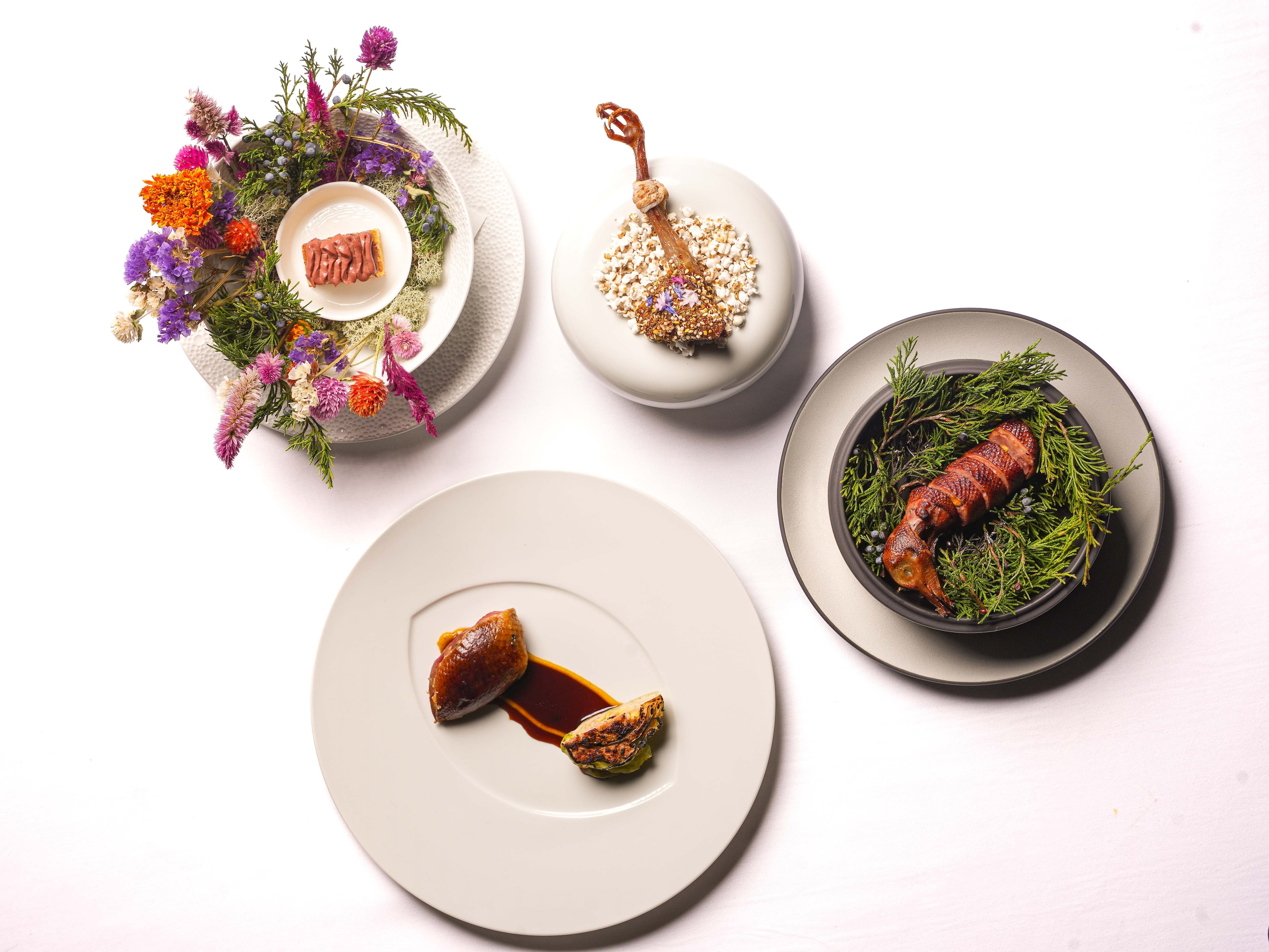 A suite of four squab dishes is called The Whole Bird from Atlas at the St. Regis Buckhead. (Courtesy of Atlas)