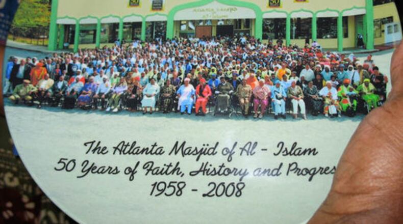 The festivities, which run Oct. 16-19, include a fashion show, a gala featuring Mayor Shirley Franklin, a 5K fund raiser for Mohammed Schools, a men's discussion on "responsibilities of manhood" and an interfaith program. Pictured, a member displays a commemorative plate on the congregation's 50th anniversary.