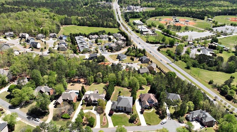 April 20, 2022 Powder Springs - Aerial photograph shows proposed area of the city of Lost Mountain in West Cobb on Wednesday, April 20, 2022. Residential area near Lost Mountain Park (right) is shown in foreground. The story plays on a fear shared by many West Cobb residents as they decide whether to incorporate the city of Lost Mountain. The county they call home is changing around them, and as conservative political power wanes in the growing Atlanta suburb, many feel helpless to protect their neighborhoods from encroaching development.(Hyosub Shin / Hyosub.Shin@ajc.com)