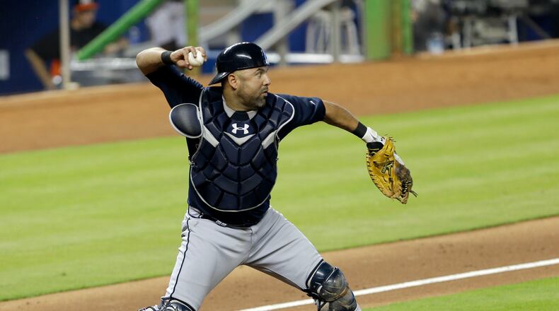 Atlanta Braves catcher Gerald Laird prepares to throw out Miami Marlins' Placido Polanco at second base on a fielder's choice by Donovan Solano in the fifth inning of a baseball game, Wednesday, July 10, 2013, in Miami. (AP Photo/Alan Diaz)