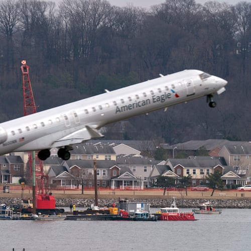 FILE - Salvage crews work on recovering wreckage near the site in the Potomac River of a mid-air collision between an American Airlines jet and a Black Hawk helicopter at Ronald Reagan Washington National Airport, Feb. 6, 2025, in Arlington, Va. (AP Photo/Jose Luis Magana, File)