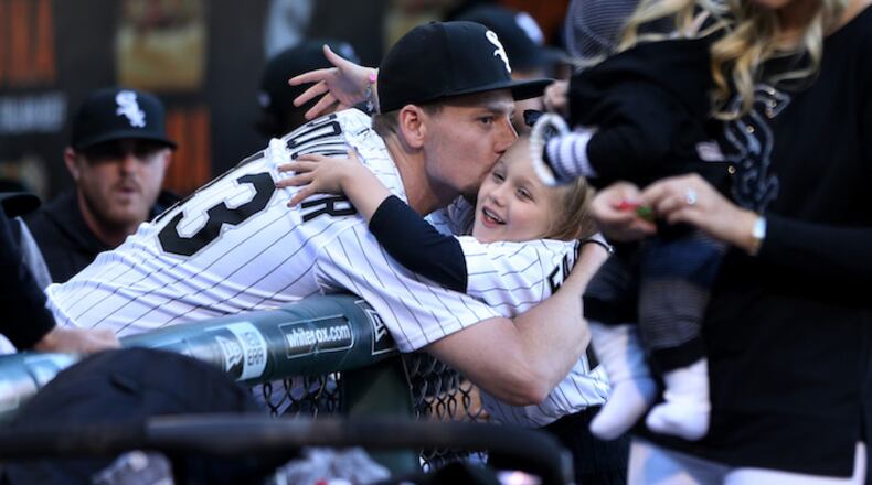 Chicago White Sox pitcher Danny Farquhar has some fun with his family before throwing out the ceremonial first pitch before a game against the Milwaukee Brewers at Guaranteed Rate Field in Chicago on June 1, 2018. Farquhar is recovering from a brain hemorrhage caused by a ruptured aneurysm that occurred in the White Sox dugout on April 20. (Chris Sweda/Chicago Tribune/TNS)