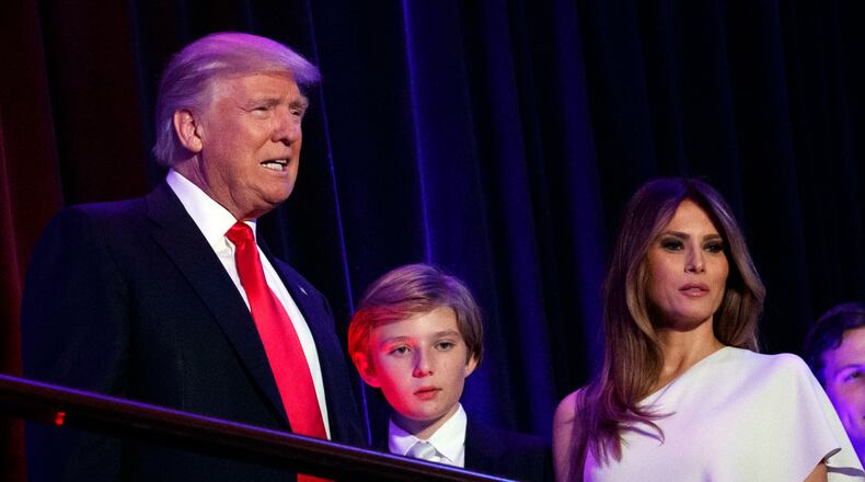 FILE - In this Nov. 9, 2016, file photo, President-elect Donald Trump, left, arrives to speak at an election night rally with his son Barron and wife Melania, in New York. Breaking with tradition, Donald Trump will move into the White House after the inauguration while wife Melania and 10-year-old son Barron plan to remain in New York City until at least the end of the school year. (AP Photo/Evan Vucci, File)
