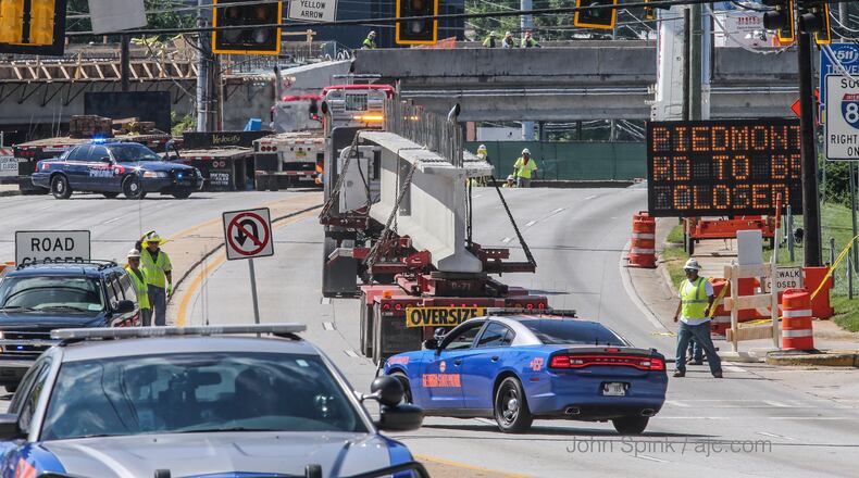 Piedmont Road is closed for 24 hours so crews can continue work to rebuild the I-85 bridge, according to the Georgia Department of Transportation. The road closed at 9 a.m. Tuesday. JOHN SPINK / JSPINK@AJC.COM