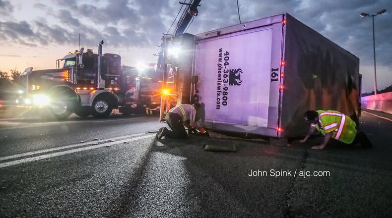 An overturned box truck on I-75 North at Central Avenue caused heavy delays between Clayton County and downtown Atlanta early Monday, authorities said.