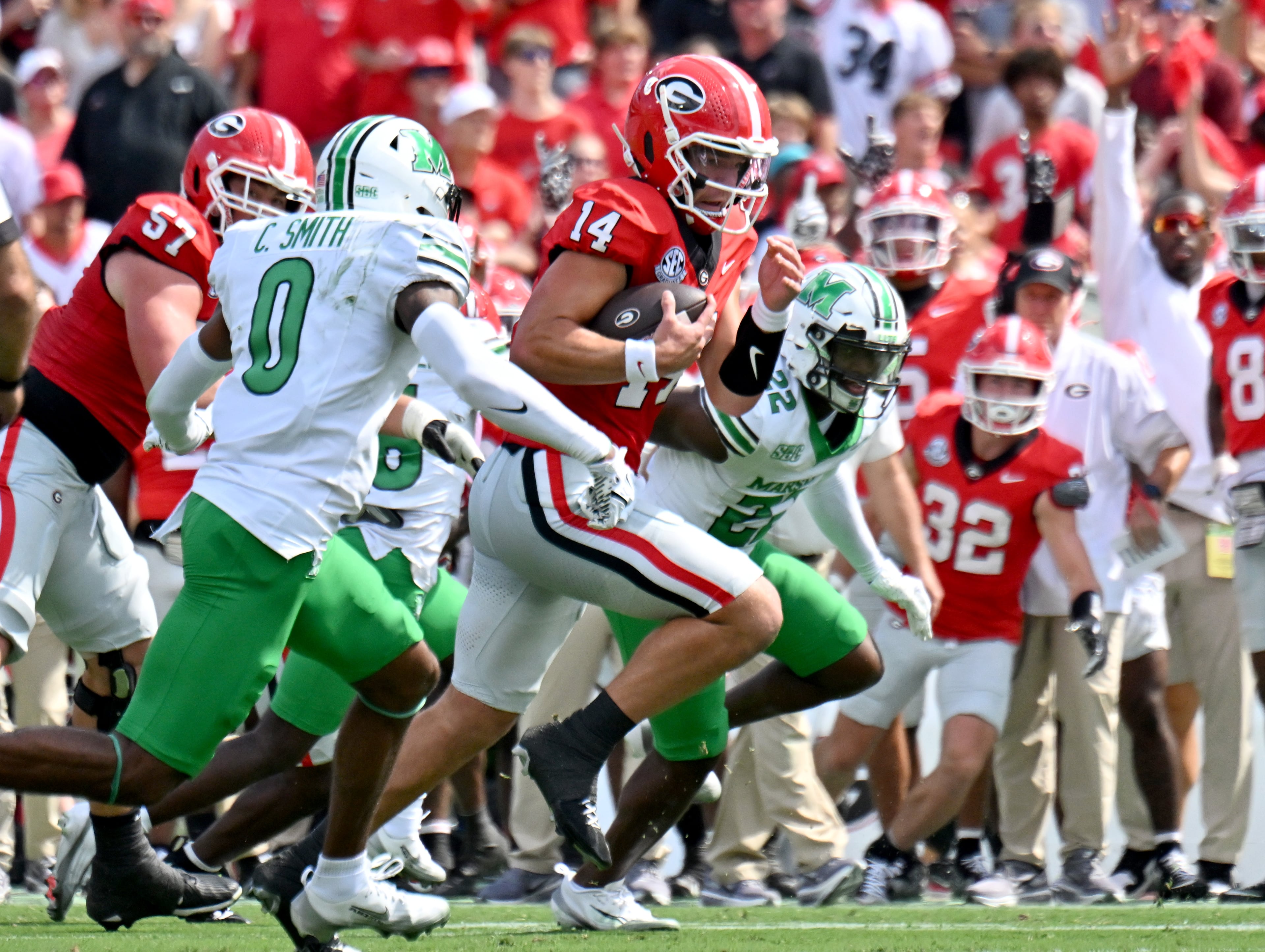 Georgia quarterback Gunner Stockton (14) runs with the ball during the first half in an NCAA football game at Sanford Stadium, Saturday, August 30, 2025, in Athens. (Hyosub Shin / AJC)