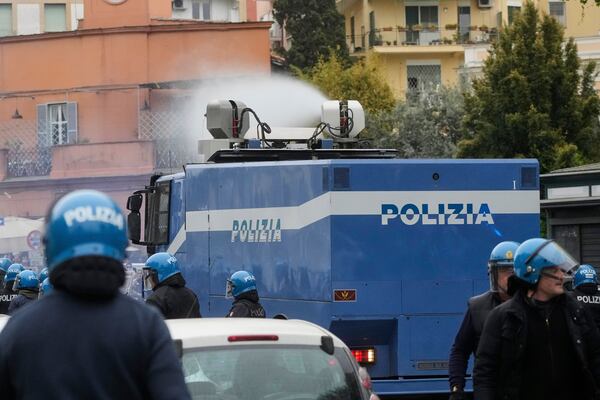 Lazio fans riot with police ahead of the Italian Serie A soccer match between Lazio and Roma at Rome's Olympic stadium, Sunday, April 13, 2025. (AP Photo/Gregorio Borgia)