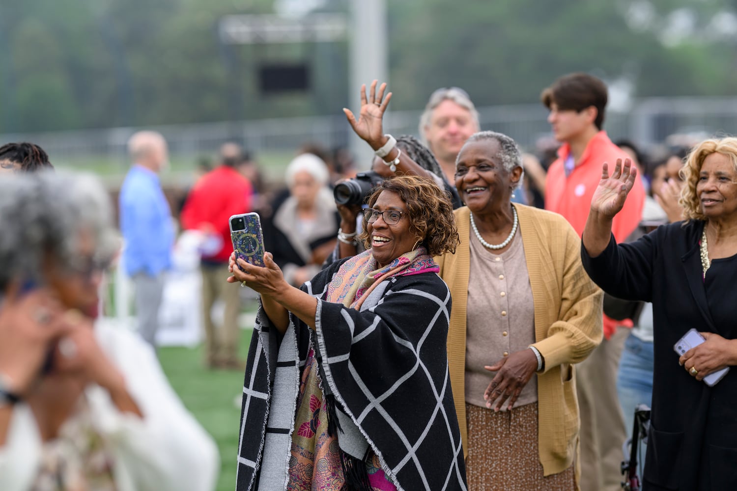 Proud family members of Berry College graduate Mykelle Patterson take photos during the Berry College commencement on Saturday, May 9, 2026. (Brant Sanderlin/Berry College) 