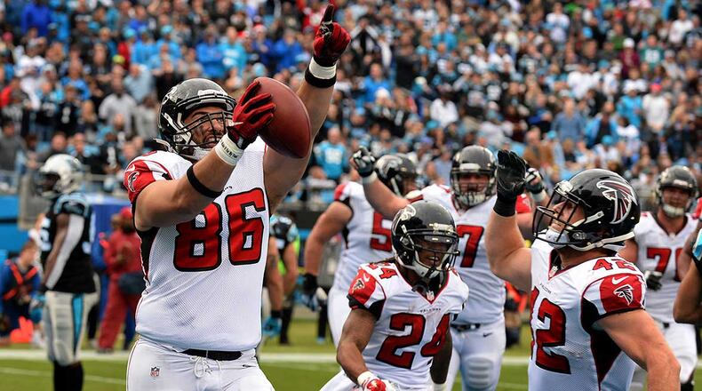 Atlanta Falcons tight end D.J. Tialavea (86) celebrates his touchdown pass reception from quarterback Matt Ryan during second-quarter action against the Carolina Panthers Saturday.