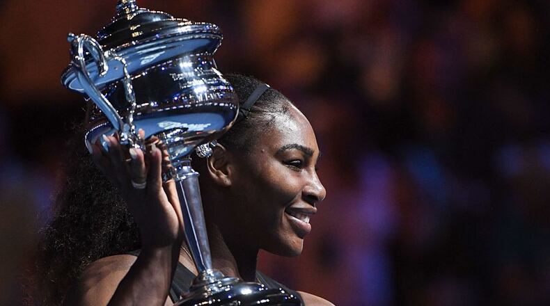 Serena Williams celebrates with the championship trophy after her victory against her sister, Venus Williams, in last January's final of the Australian Open.
