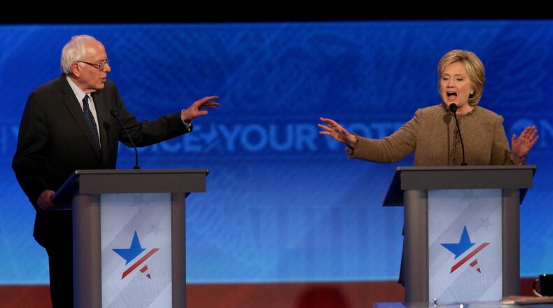 Democratic president candidates Bernie Sanders and Hillary Clinton debate at Saint Anselm College December 19, 2015 in Manchester, New Hampshire. (Andrew Burton/Getty Images)