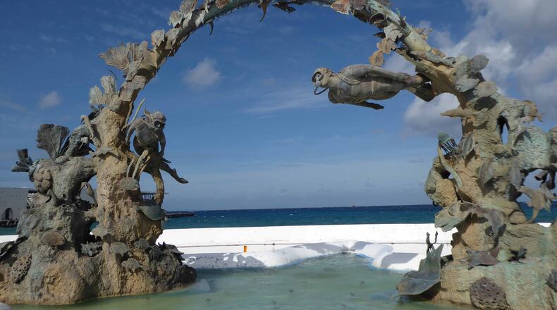 A sculpture depicting scuba divers illustrates the island’s importance as a diving mecca. (Patricia Harris)
