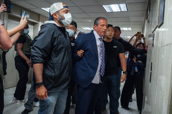 New York City Comptroller Brad Lander is placed under arrest by Immigration and Customs Enforcement (ICE) and FBI agents outside federal immigration court on Tuesday, June 17, 2025, in New York. (AP Photo/Olga Fedorova)