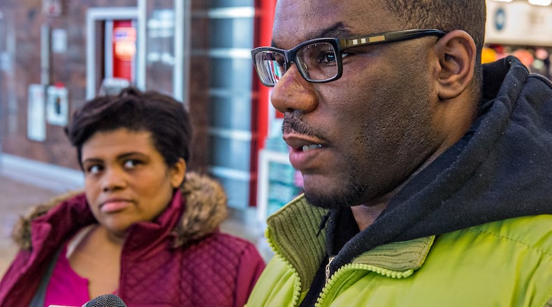 Nov. 14, 2015 Atlanta — Will Bogle (right) and his wife Rebecca Hill-Bogle talk about their experience in Paris, France after exiting customs in the international terminal of the Hartfield Jackson International Airport in Atlanta on Saturday, November 14, 2015. JONATHAN PHILLIPS / SPECIAL