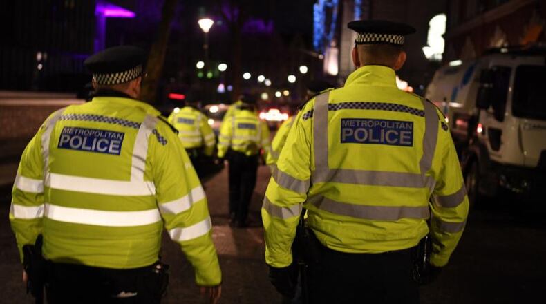 Police had three people in custody and were looking for a fourth.