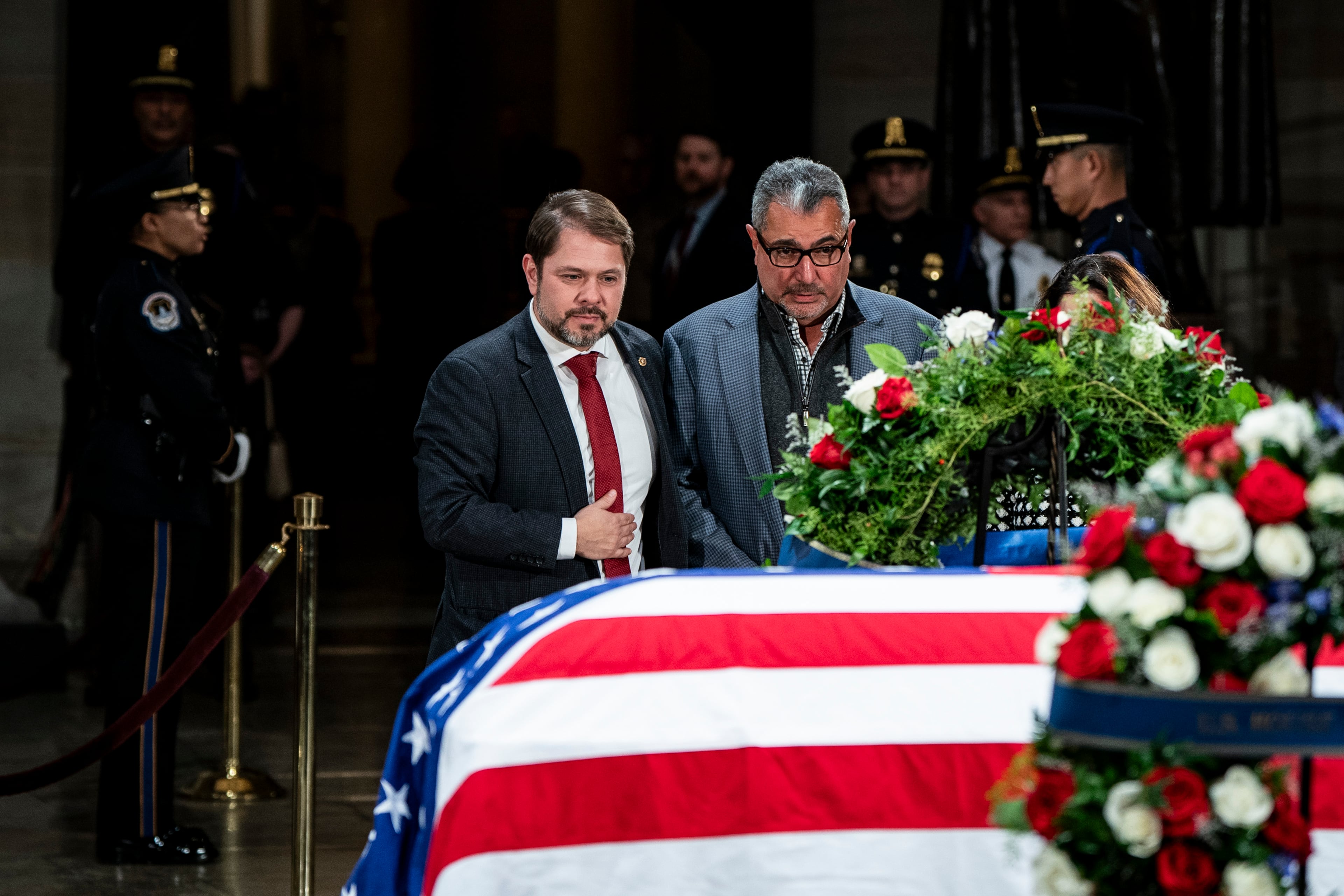Sen. Ruben Gallego (D-Ariz.), left, pays respects to former President Jimmy Carter as Carter lies in state in the Rotunda of the Capitol in Washington, on Wednesday, Jan. 8, 2025. Gallego is one of seven Hispanic senators in Congress. (Haiyun Jiang/The New York Times)