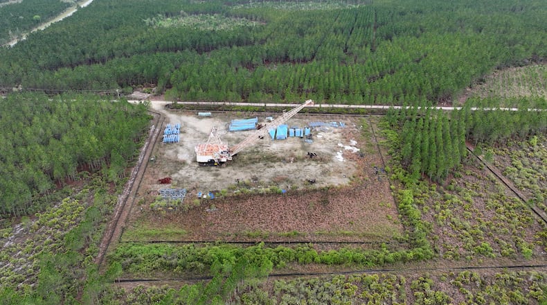 Drone photograph shows the Twin Pines mine site where equipment is stationed on Monday, March 18, 2024, in Charlton County. The site is located less than 3 miles from the Okefenokee National Wildlife Refuge, the largest U.S. refuge east of the Mississippi River. Last month, the Georgia Environmental Protection Division released draft permits to Twin Pines Minerals for a 582-acre mine that would extract titanium and other minerals from atop the ancient sand dunes on the swamp’s eastern border, which holds water in the refuge. (Hyosub Shin / Hyosub.Shin@ajc.com)