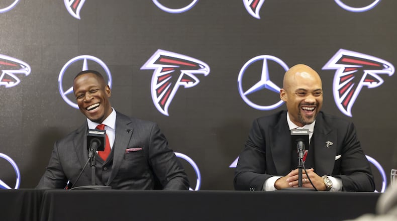 Falcons coach Raheem Morris and general manager Terry Fontenot share a laugh while responding to a question during Monday's introductory press conference.