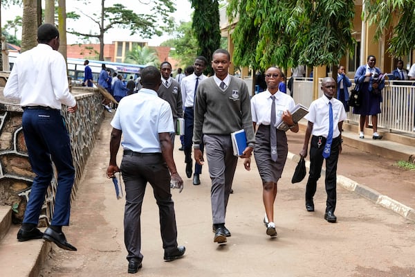 Students walk around the school compound at Uganda Martyrs' Secondary School Namugongo, in Kampala, Uganda Monday, May 26, 2025. (AP Photo/Hajarah Nalwadda)