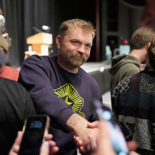 Graham Platner, Democratic candidate for U.S. Senate, greets supporters after speaking at an event hosted by Sen. Bernie Sanders in Orono, Maine, Sunday, May 24, 2026. (AP Photo/Robert F. Bukaty)