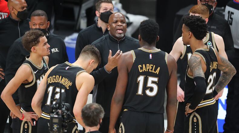 070321 Atlanta: Atlanta Hawks interim head coach Nate McMillan and Trae Young (from left), Bogdan Bogdanovic, Clint Capela, John Collins, and Kevin Huerter try to mount another come back against the Milwaukee Bucks that falls short during the fourth quarter in game 6 of the NBA Eastern Conference Finals on Saturday, July 3, 2021, in Atlanta.   “Curtis Compton / Curtis.Compton@ajc.com”