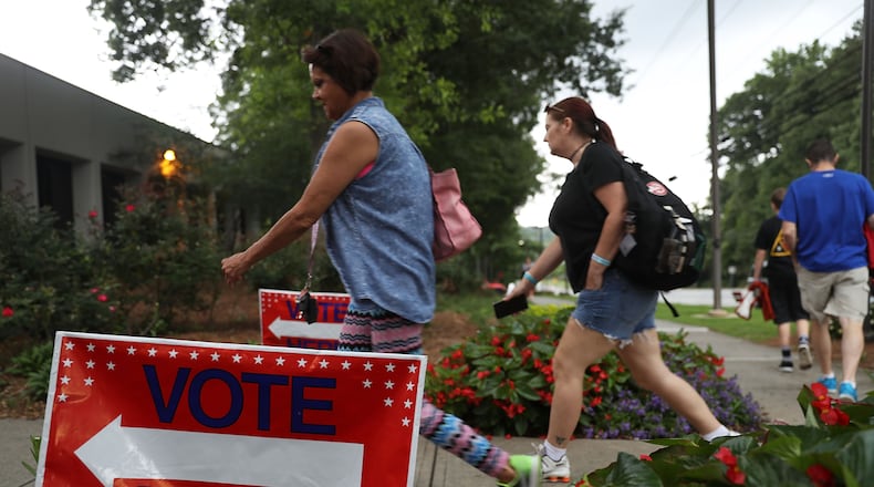Voters walk to a polling place as ballots are cast during a special election in Georgia's 6th Congressional District at North Fulton Government Service Center on June 20, 2017 in Sandy Springs, Georgia. (Photo by Joe Raedle/Getty Images)
