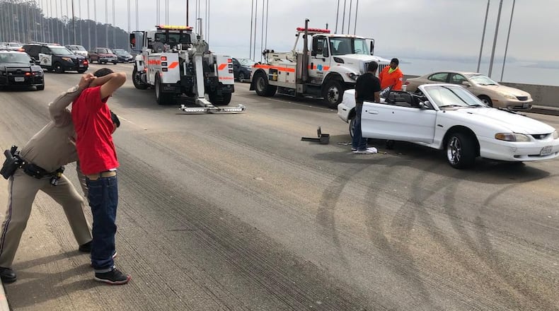 A driver suspected of being part of a sideshow that closed a bridge in San Francisco Sunday was arrested when his car became disabled. (Photo: California Highway Patrol/Twitter)