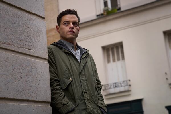 This image released by 20th Century Studios shows Rami Malek in a scene from "The Amateur." (John Wilson/20th Century Studios via AP)
