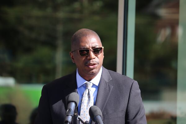 Norcross Mayor Craig Newton speaks during a Tuesday ribbon-cutting ceremony for the city's new branch of the Gwinnett County Public Library. He said it will help connect the communities divided by Buford Highway. (Tyler Wilkins / tyler.wilkins@ajc.com)
