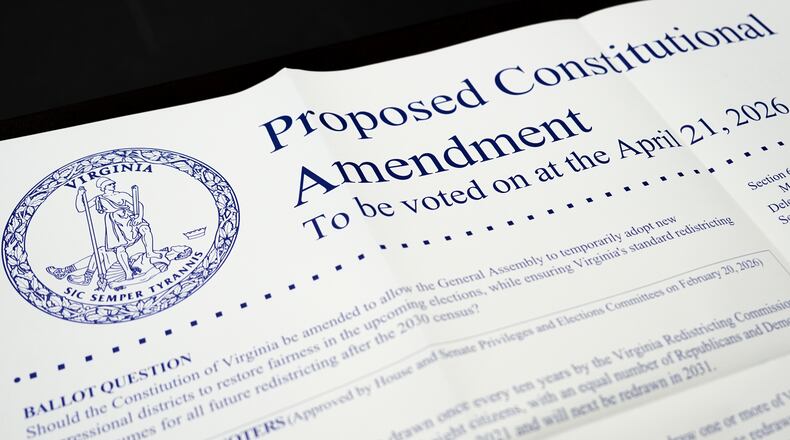 A poster on the Virginia redistricting referendum is seen during voting at Mason Square, Tuesday, April 21, 2026, in Alexandria, Va. (AP Photo/Julia Demaree Nikhinson)